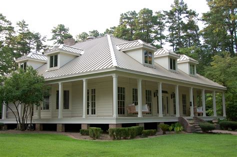 beige house with metal roof